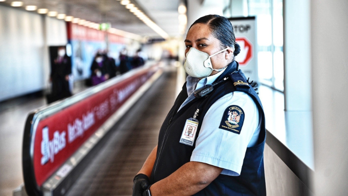Customs worker wearing a mask