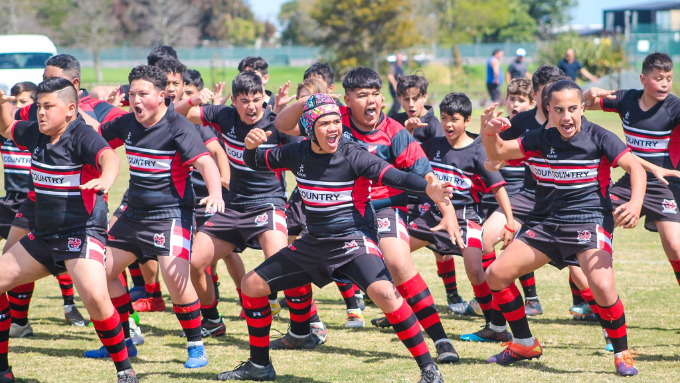 young rugby club/team preforming a haka before their game young rugby club/team preforming a haka before their game