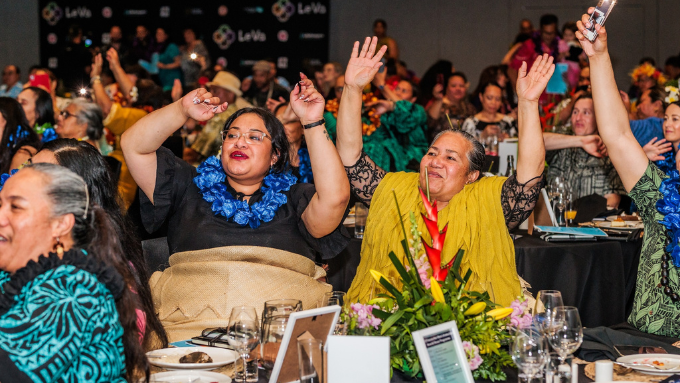 le va convention with the camera facing two Pacific women who have their hands in the air le va convention with the camera facing two Pacific women who have their hands in the air