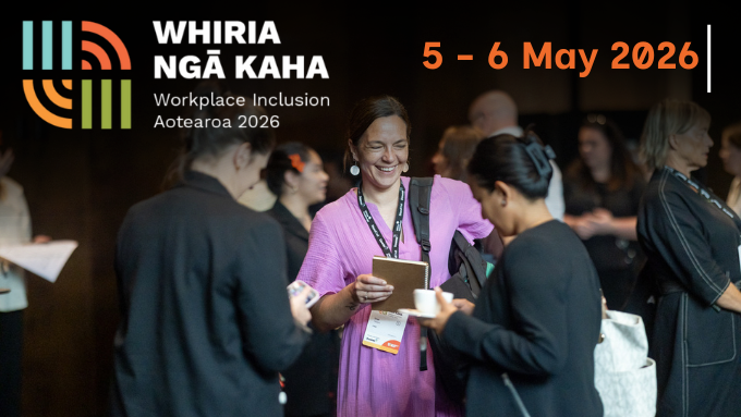 People standing around talking at a conference