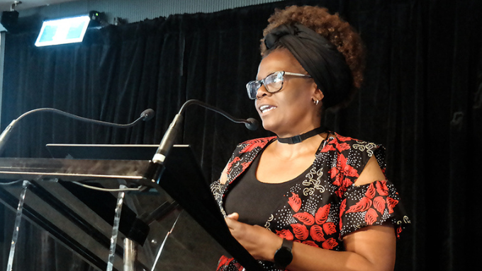 Woman giving a speech at a podium