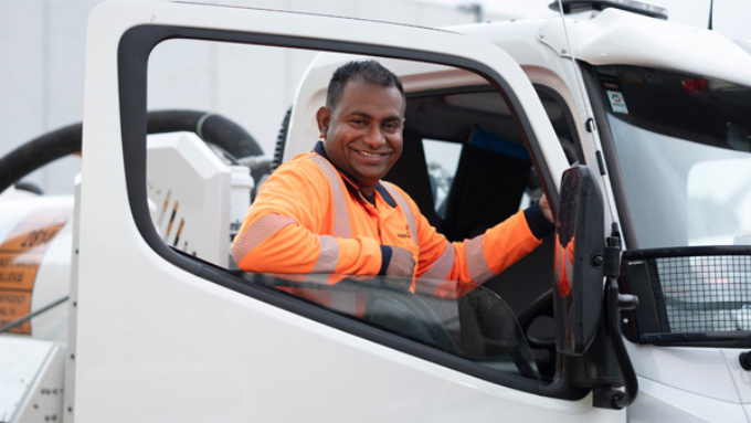 Watercare worker pictured in driver's window of company vehicle Watercare worker pictured in driver's window of company vehicle