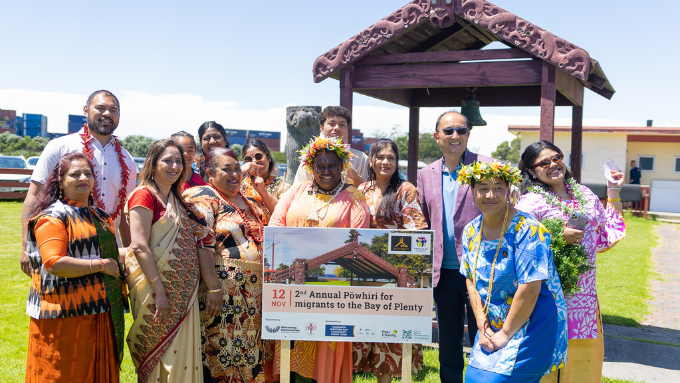 a cultural diverse group photo outside where everyone's dressed traditionally outdoors 