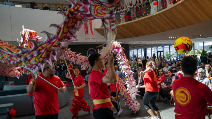 Chinese dancers performing a traditional dragon dance to a crowd Chinese dancers performing a traditional dragon dance to a crowd