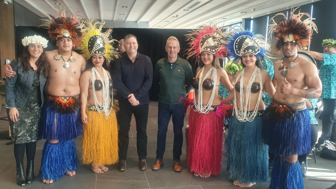 Pacific island dancers taking a group photo with foodstuffs north island CEO's
