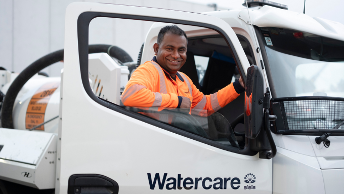 water care worker smiling inside his watercare truck water care worker smiling inside his watercare truck