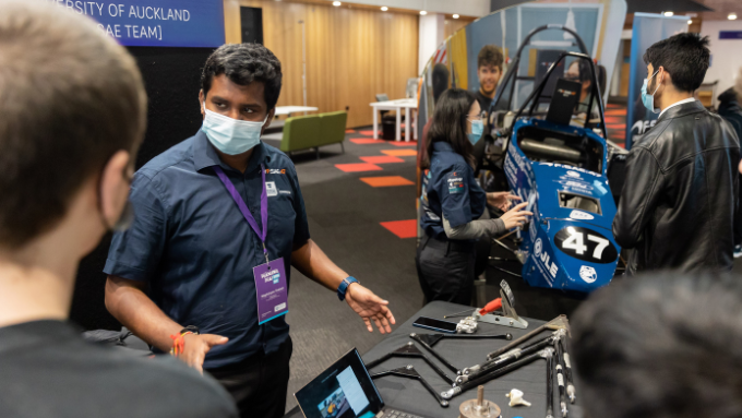Waipapa Taumata Rau University of Auckland male presenting mechanical parts at a trade show Waipapa Taumata Rau University of Auckland male presenting mechanical parts at a trade show