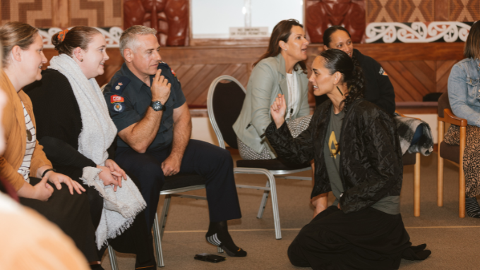tanga te whenua whaea explaining something compelling to a fire fighter tanga te whenua whaea explaining something compelling to a fire fighter