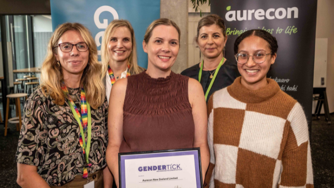 five women with the winner of this award facing the camera smiling in this group photo for aurecon 