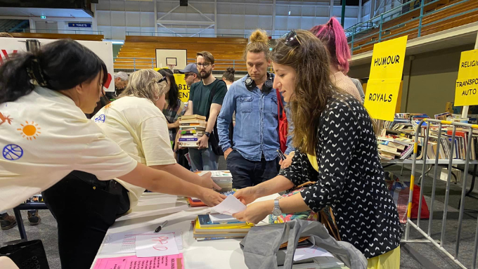 DUAL New Zealand Limited staff selling and purchasing books