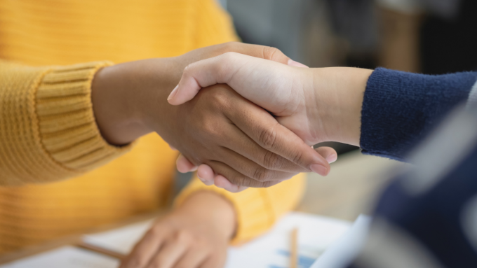 Two hands shaking on a deal