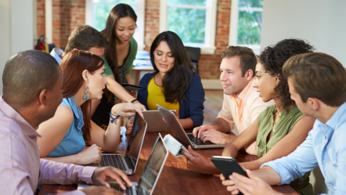 Diverse group of people working together, engaged in a discussion