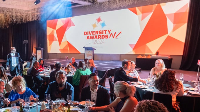 shot of stage with people in the foreground at 2024 Diversity Awards NZ shot of stage with people in the foreground at 2024 Diversity Awards NZ